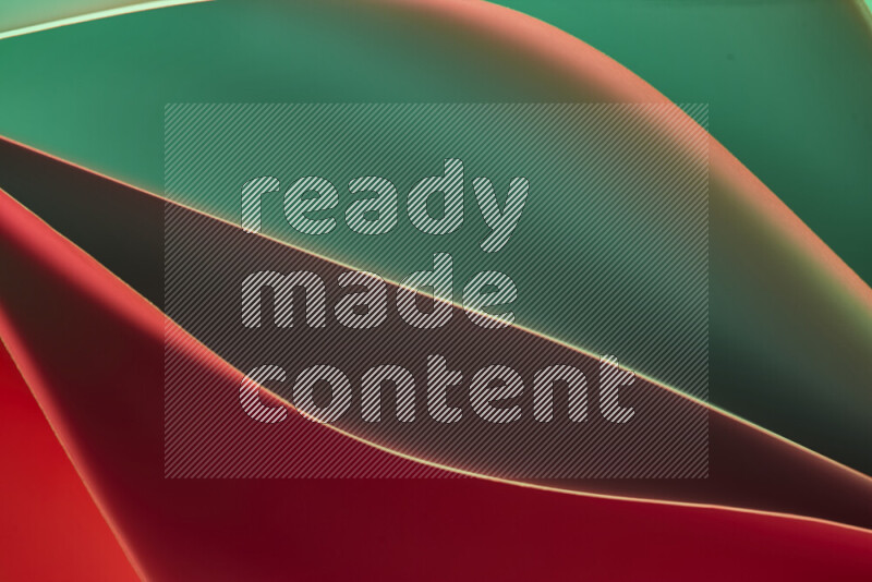 This image showcases an abstract paper art composition with paper curves in green and red gradients created by colored light