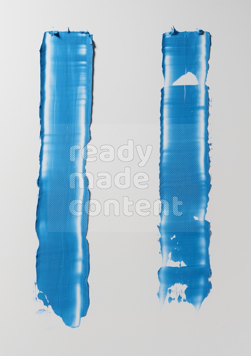 Blue painting knife strokes on white background