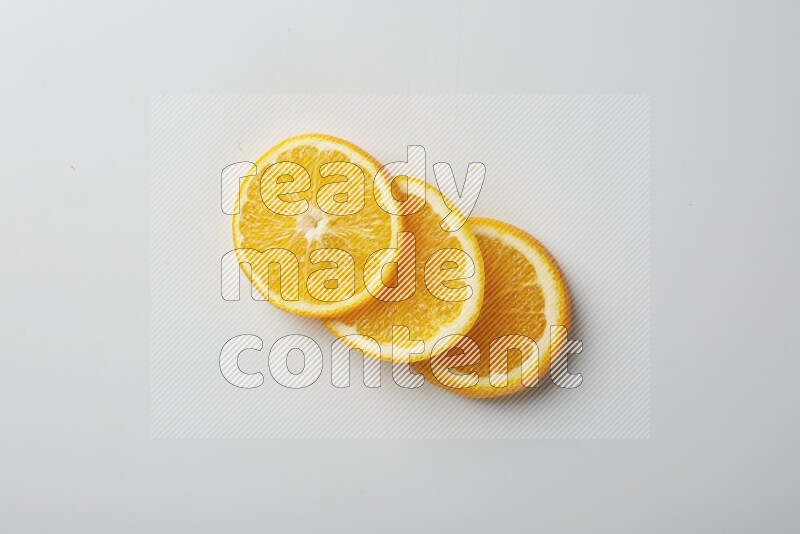 Three orange slices on a white background