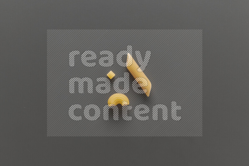 Different pasta types on grey background