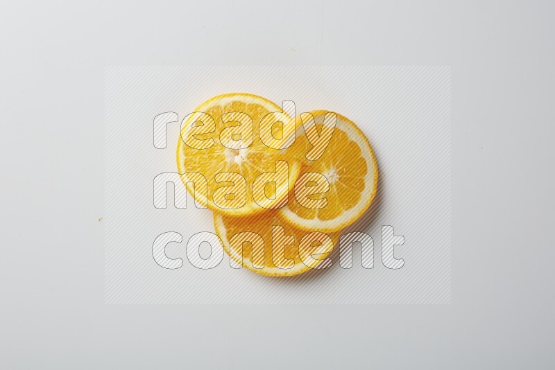 Three orange slices on a white background