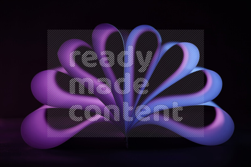 An abstract art piece displaying smooth curves in blue and purple gradients created by colored light