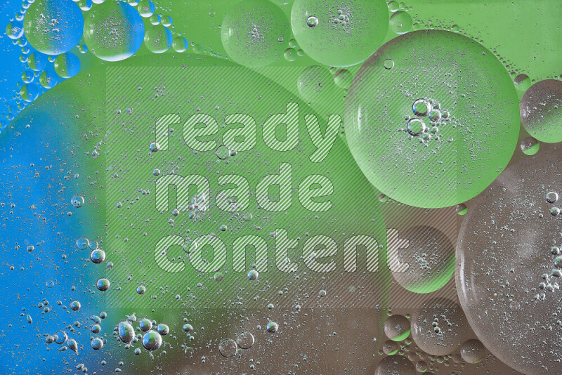 Close-ups of abstract oil bubbles on water surface in shades of brown, green and blue