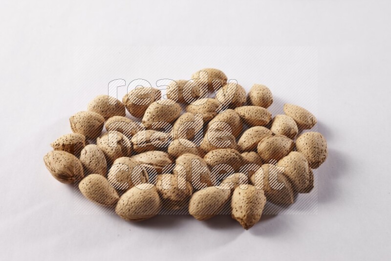 Almonds on white background