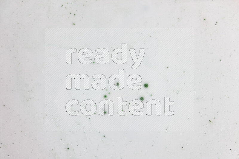 The image presents a swirl of pastel pink and pale blue with green droplets on white background