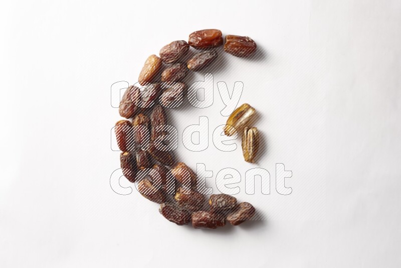 Dates in a crescent shape on white background