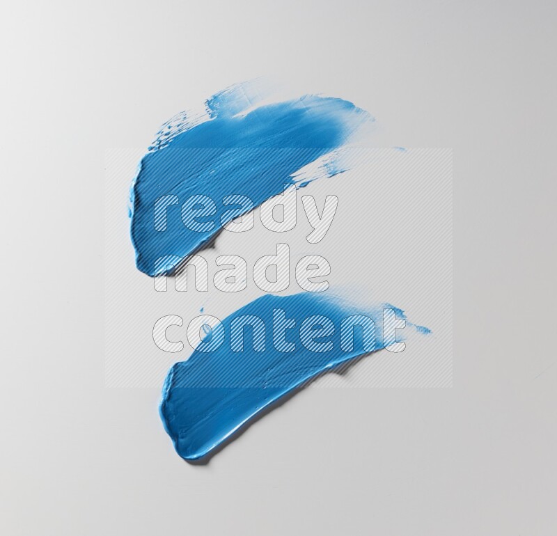 Blue painting knife strokes on white background