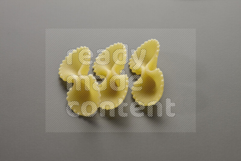 Fiocchi pasta on grey background