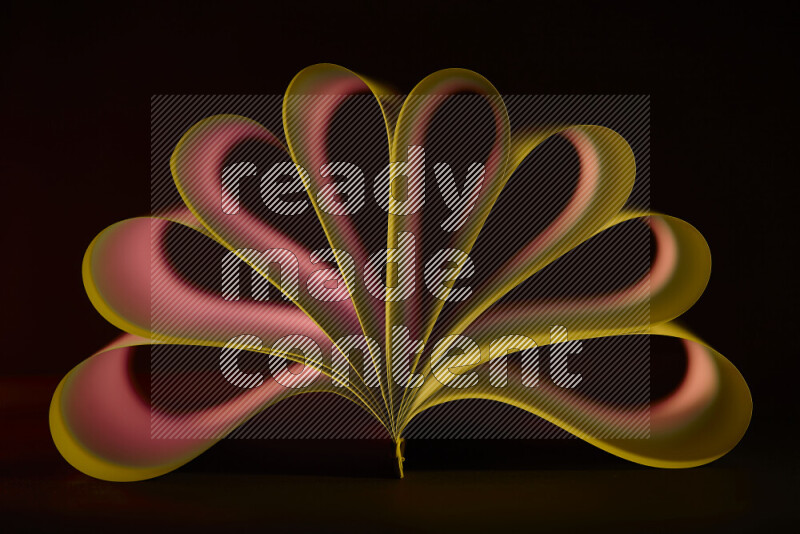 An abstract art piece displaying smooth curves in yellow and red gradients created by colored light