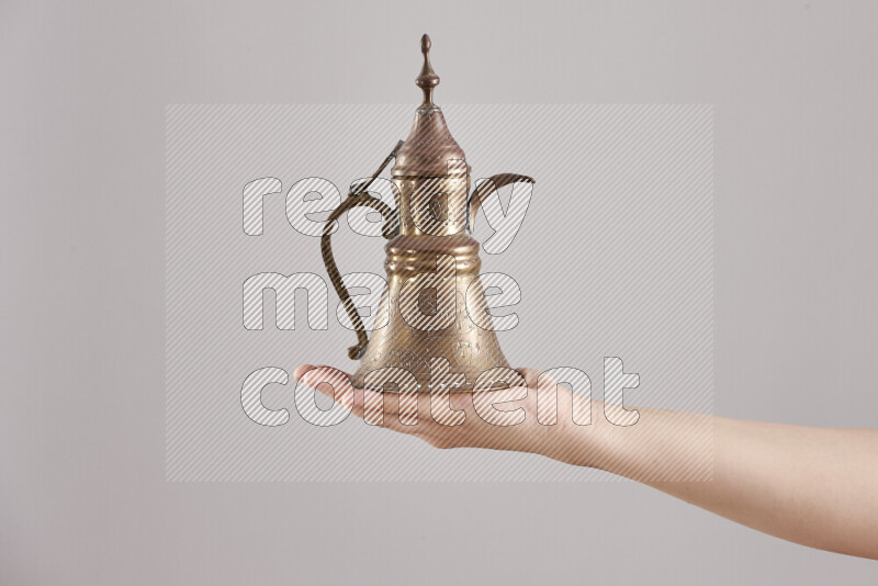 Woman hands holding different metal essentials in different positions
