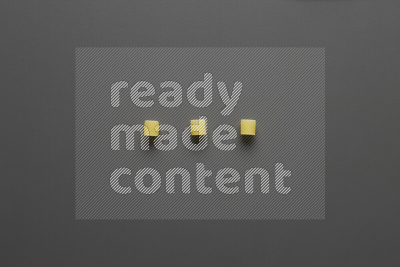 Small rings pasta on grey background