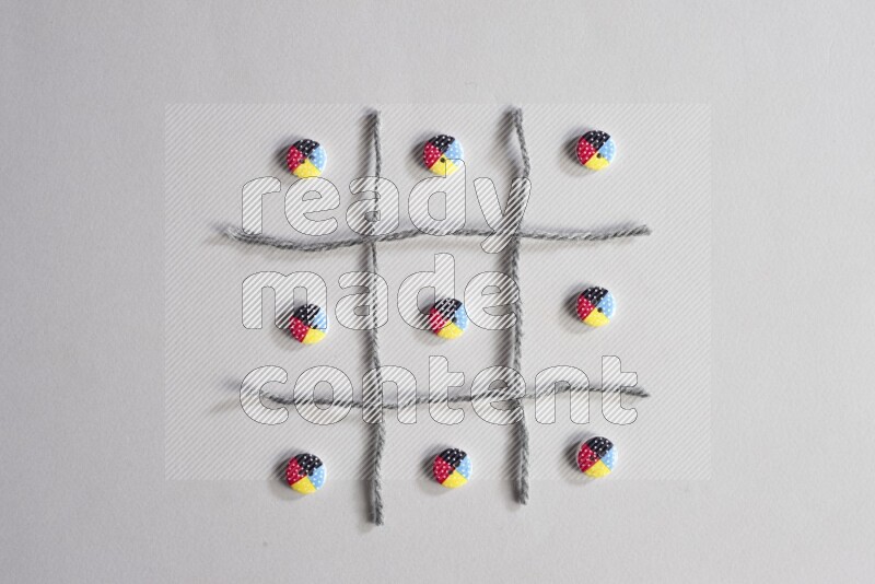 Multicolored buttons placed on grey background