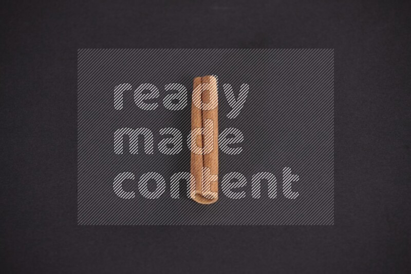 Cinnamon stick on black background