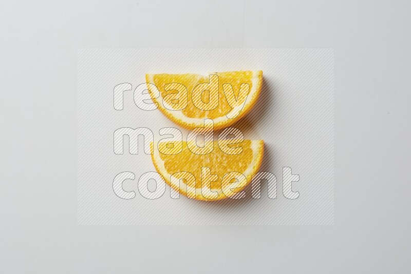 Two halves of an orange slices on white background