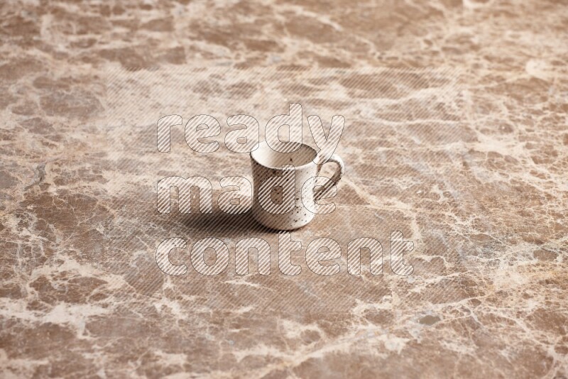 Pottery Cup on Beige Marble Flooring