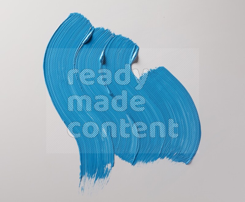 Multi blue curved brush strokes shaped into different shapes on a white background
