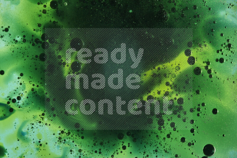 Close-ups of abstract green watercolor drops on oil Surface on green background