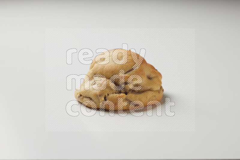 a chocolate chip cookie on a white background
