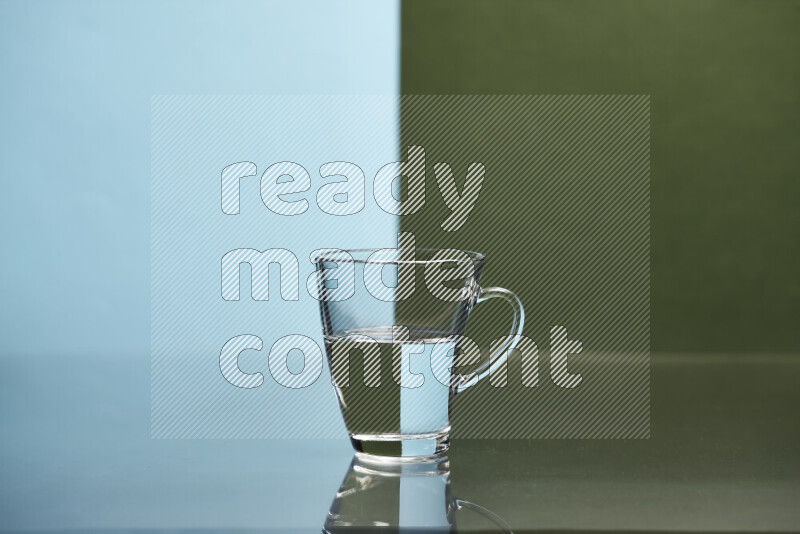 The image features a clear glassware filled with water, set against light blue and dark green background