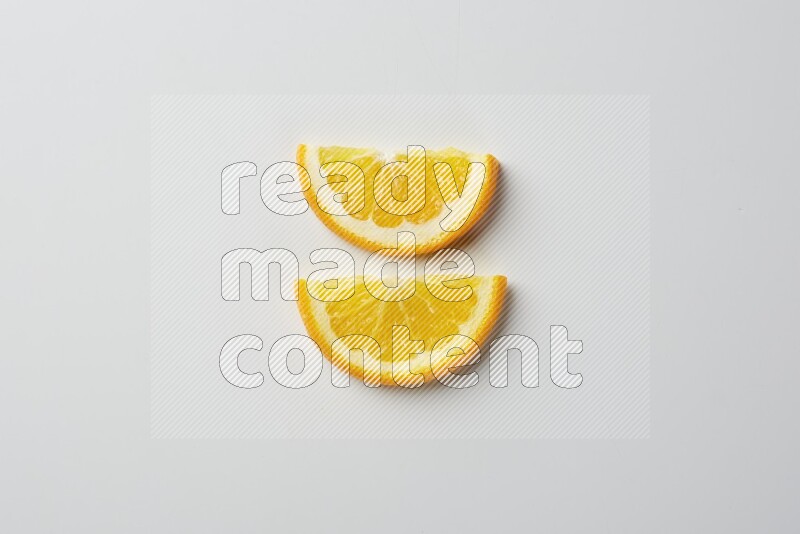 Two halves of an orange slices on white background