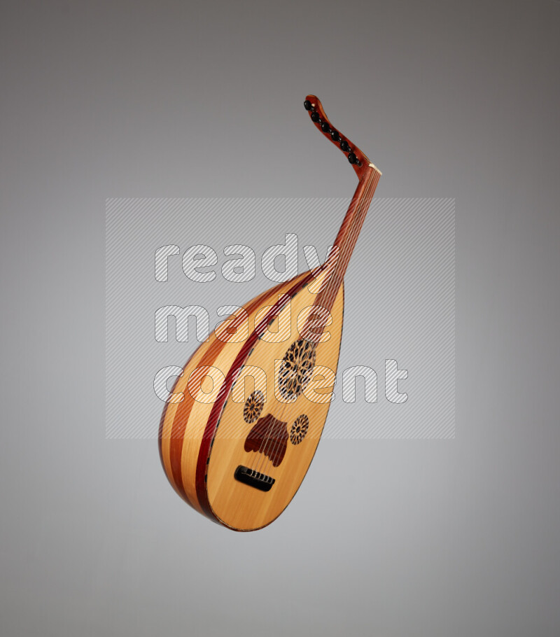 a wooden brown Oud on a gray background