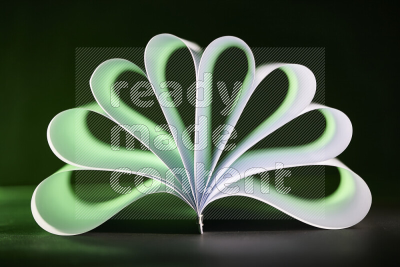 An abstract art piece displaying smooth curves in green and white gradients created by colored light