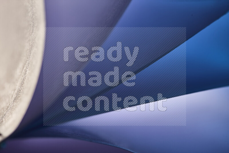 An abstract art piece displaying smooth curves in cold gradients created by colored light