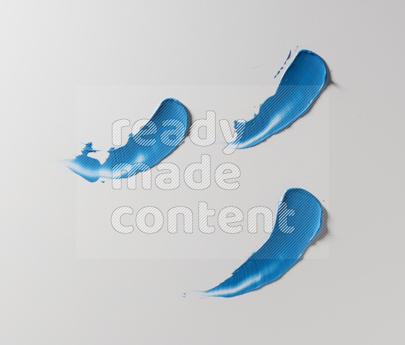 Blue painting knife strokes on white background