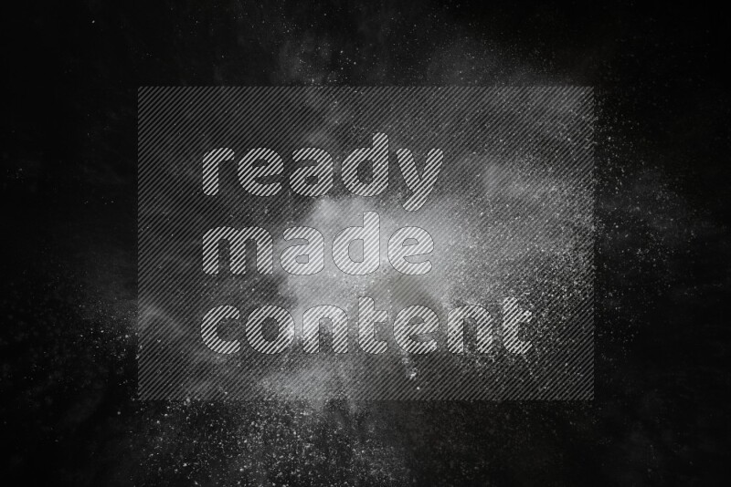 White powder explosion on black background
