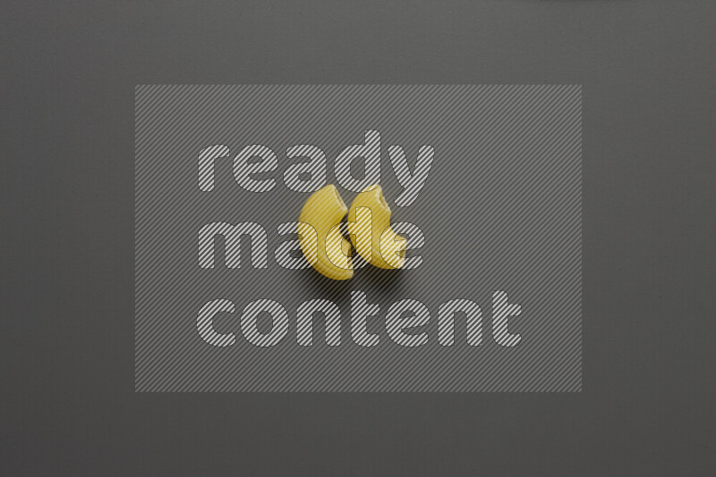 Elbow pasta on grey background