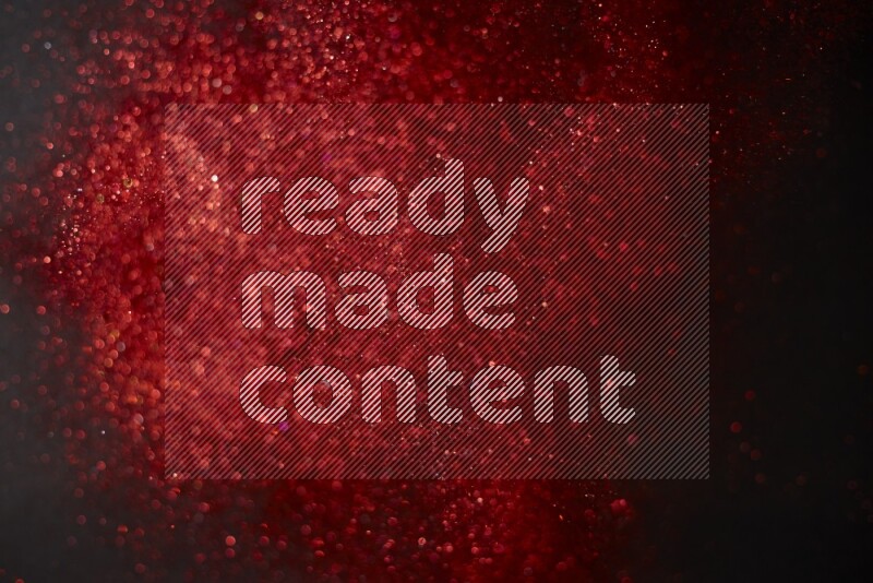 Red glitter powder isolated on black background