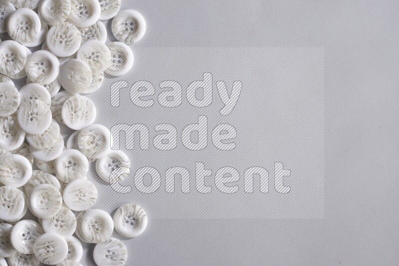 White buttons placed on grey background