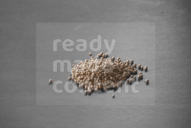 White pepper on a black flooring