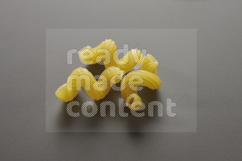 Twist pasta on grey background
