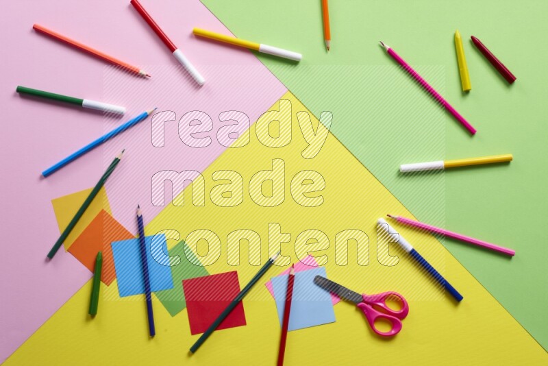 Different school supplies on multicolored background