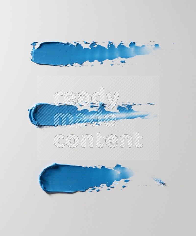 Blue painting knife strokes on white background