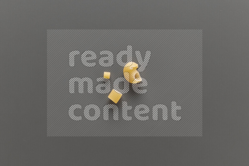 Different pasta types on grey background