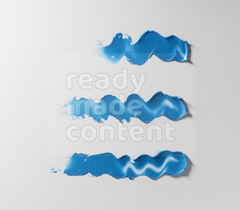 Blue zigzag painting knife strokes on white background