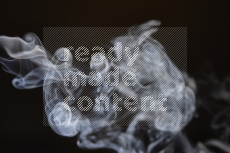 Motion of wavy smoke isolated on dark background
