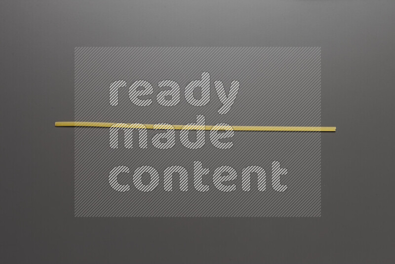 Linguini pasta on grey background