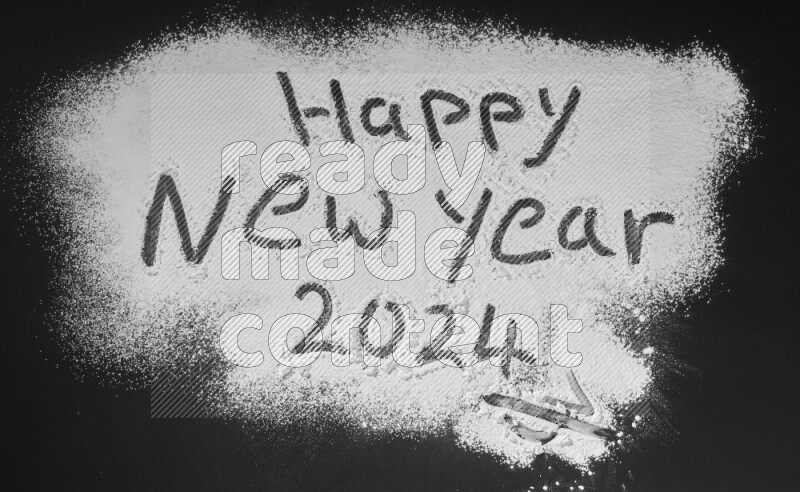 A sentence written with powder on black background