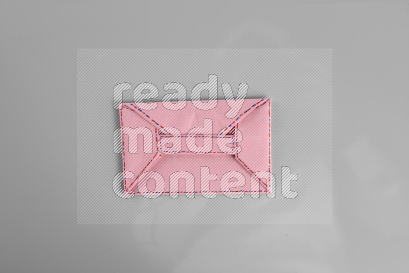 Origami envelope on grey background