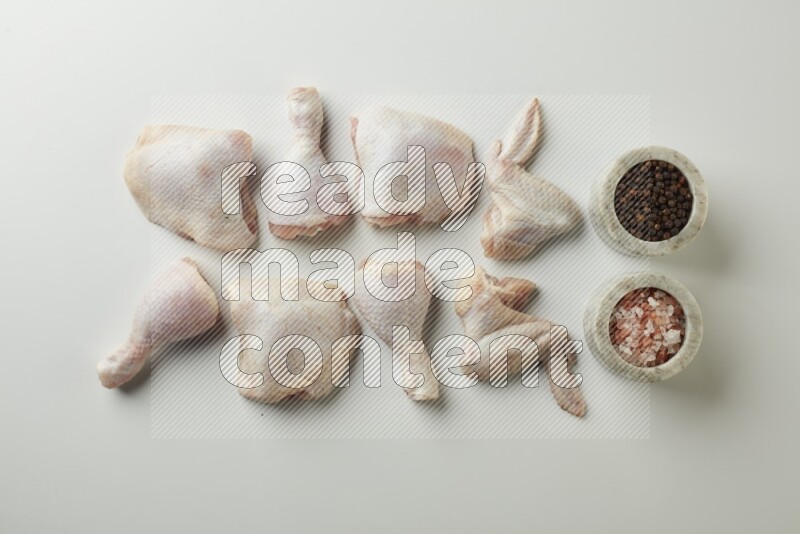 Mixed fresh chicken pieces direct on a white background