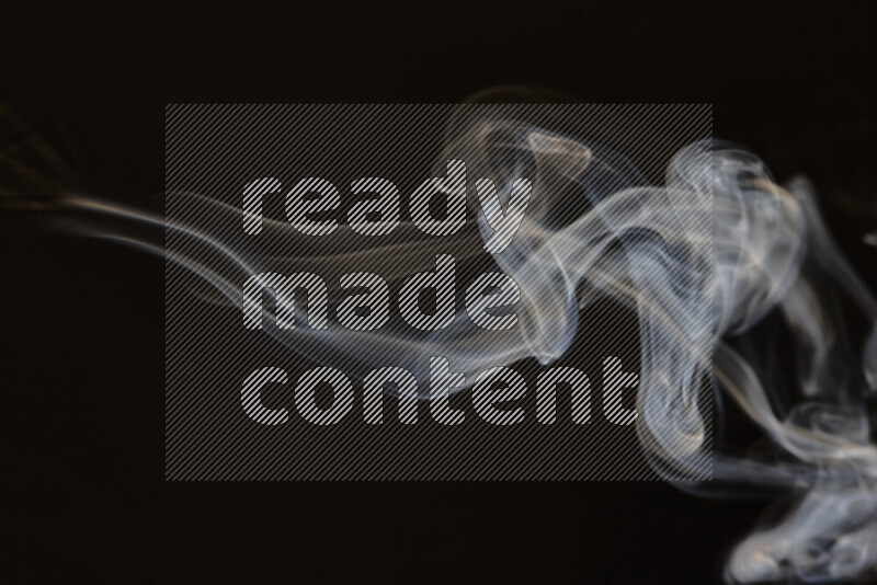 Motion of wavy smoke isolated on dark background