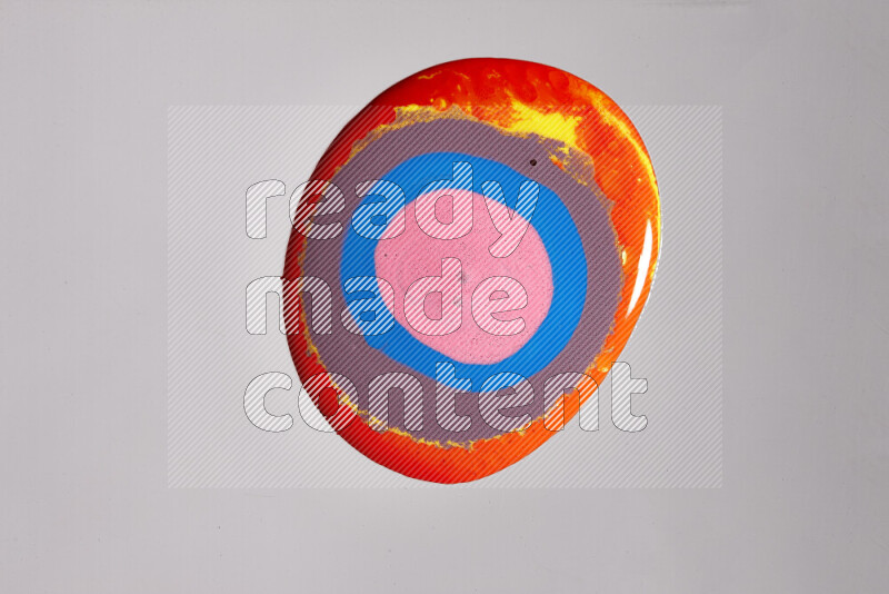 Close-ups of assorted colors blending on a grey background