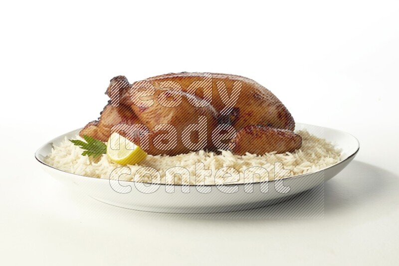 white  basmati Rice with  whole roasted chicken  on a white plate with a silver rim direct  on white background