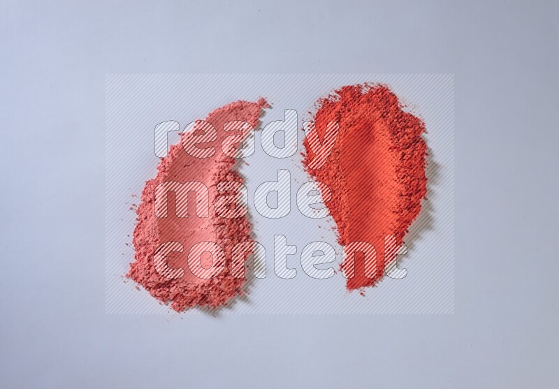 Red powder smears on white background