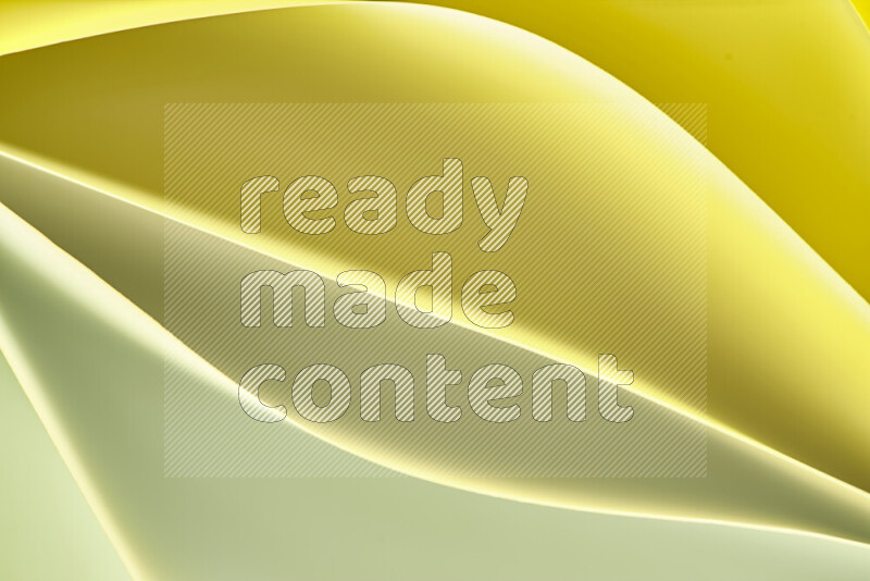 This image showcases an abstract paper art composition with paper curves in gold gradients created by colored light