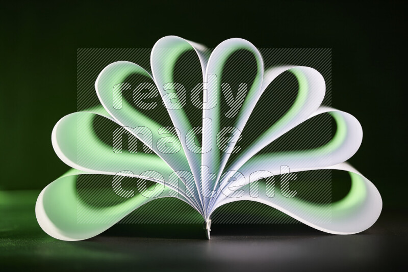 An abstract art piece displaying smooth curves in green and white gradients created by colored light