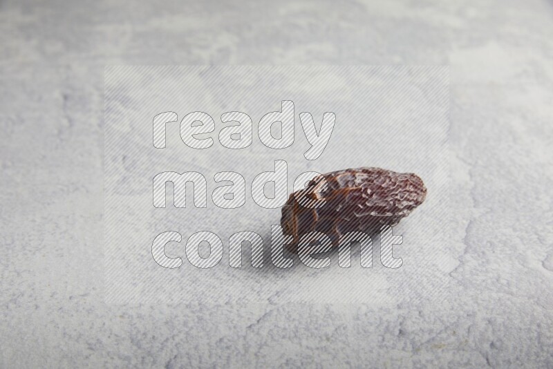 one madjoul date on a light grey background